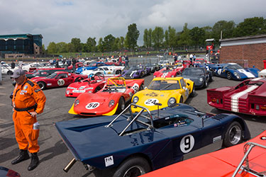 Historic sports cars in the GP paddock after qualifying